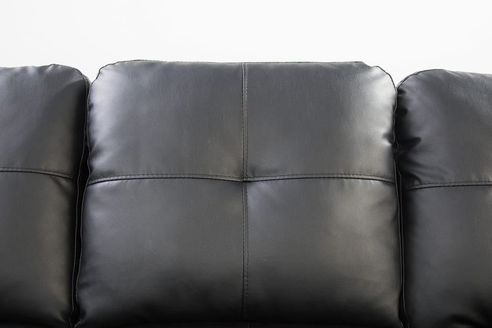 Black Leather Sectional with Stud Details